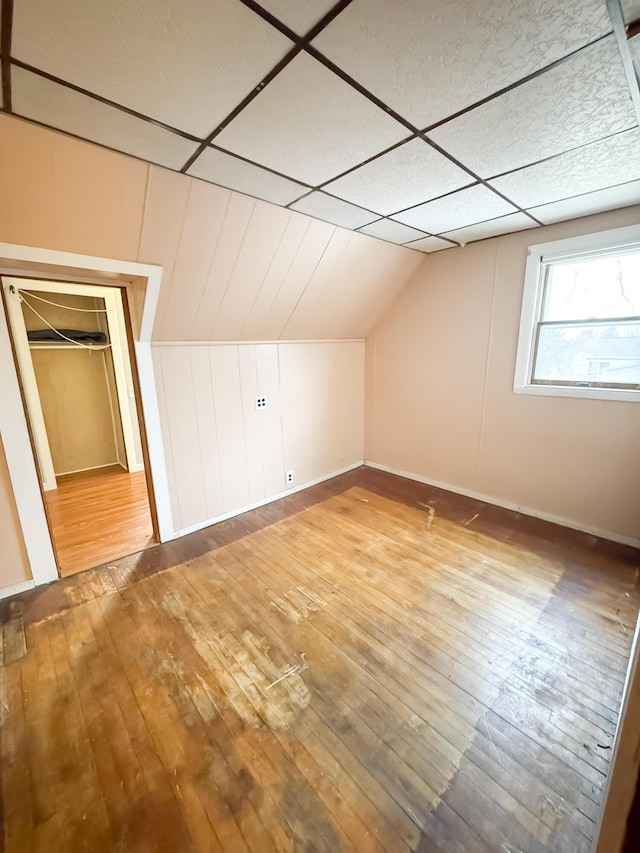 12 Pleasant St, Howland, ME 04448 - additional living space with vaulted ceiling, hardwood / wood-style flooring, and baseboards
