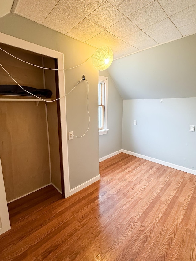 12 Pleasant St, Howland, ME 04448 - additional living space with wood finished floors, baseboards, and lofted ceiling