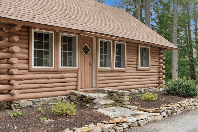 52 Main St, Sanford, ME 04083 - entrance to property featuring log exterior and roof with shingles