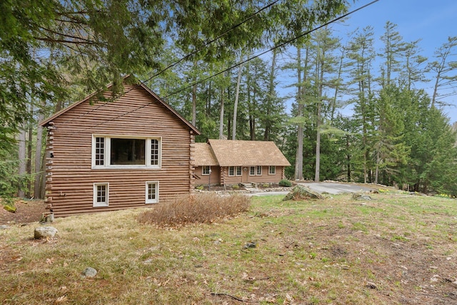 52 Main St, Sanford, ME 04083 - view of side of property featuring log exterior