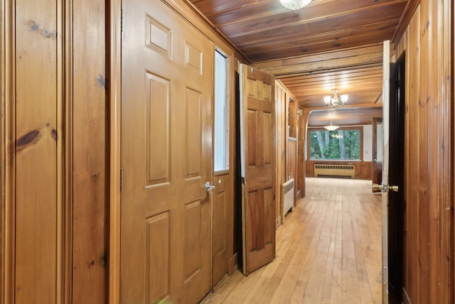 52 Main St, Sanford, ME 04083 - corridor with wooden ceiling, radiator heating unit, and light wood-type flooring