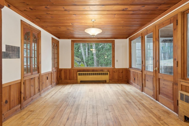 52 Main St, Sanford, ME 04083 - unfurnished sunroom featuring french doors and radiator heating unit