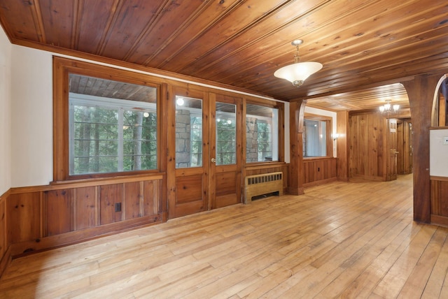 52 Main St, Sanford, ME 04083 - empty room featuring wooden walls, wooden ceiling, and radiator