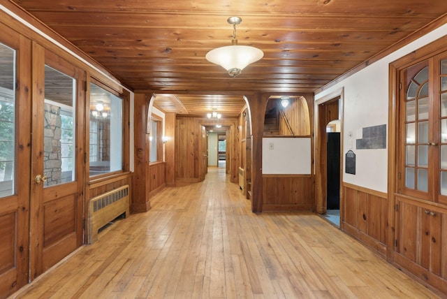 52 Main St, Sanford, ME 04083 - interior space with wainscoting, light wood-type flooring, wooden ceiling, wooden walls, and radiator