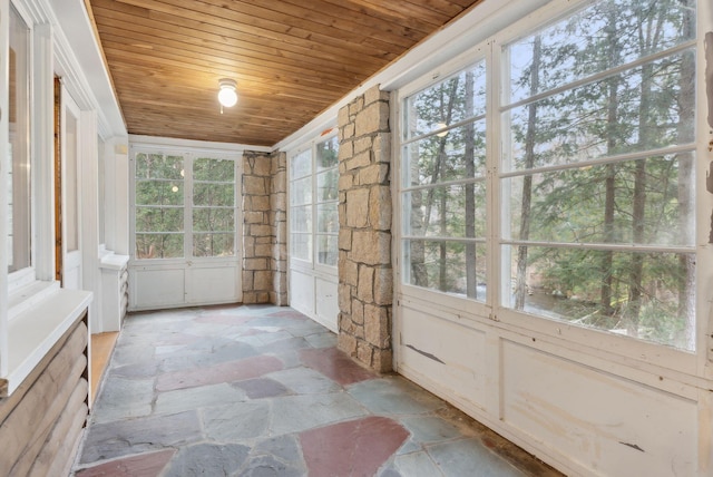 52 Main St, Sanford, ME 04083 - unfurnished sunroom with wood ceiling and stone finish floor