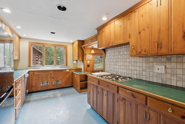 52 Main St, Sanford, ME 04083 - kitchen with brown cabinetry, recessed lighting, a sink, backsplash, and stainless steel gas stovetop
