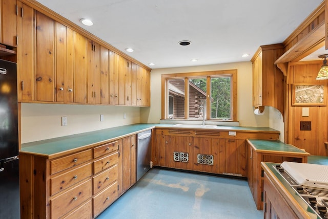 52 Main St, Sanford, ME 04083 - kitchen featuring brown cabinetry, stainless steel dishwasher, a sink, freestanding refrigerator, and recessed lighting