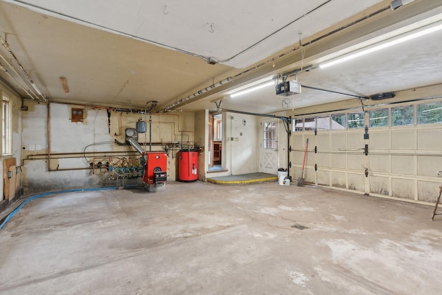 52 Main St, Sanford, ME 04083 - garage with water heater and a garage door opener