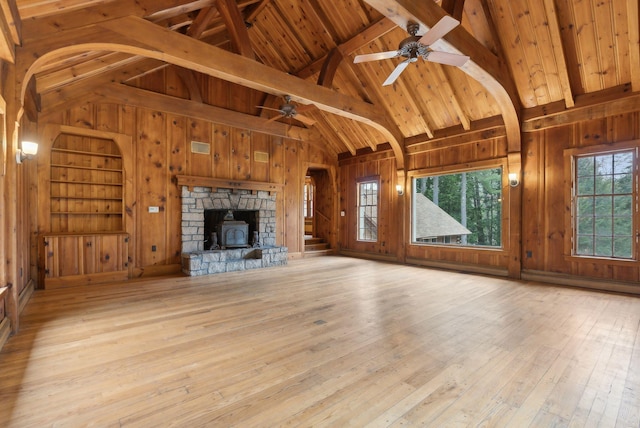 52 Main St, Sanford, ME 04083 - unfurnished living room featuring vaulted ceiling with beams, ceiling fan, and wooden walls