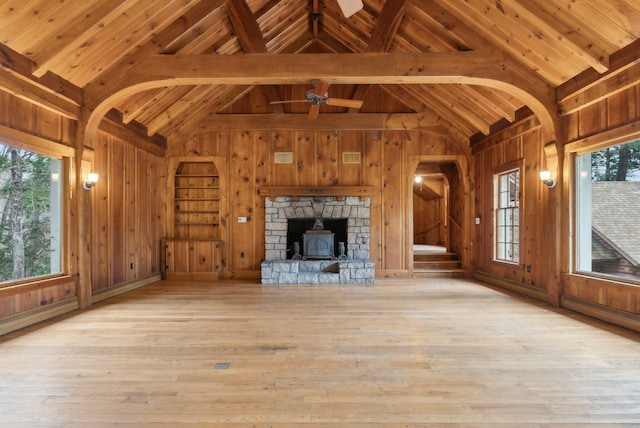 52 Main St, Sanford, ME 04083 - unfurnished living room with wooden walls, wooden ceiling, lofted ceiling with beams, and hardwood / wood-style flooring