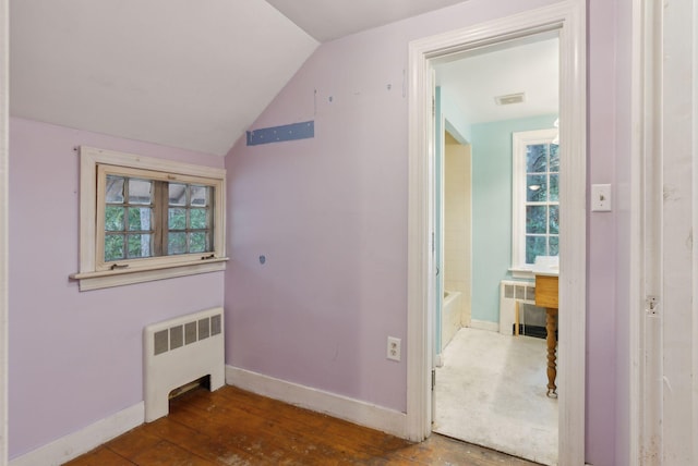 52 Main St, Sanford, ME 04083 - interior space with baseboards, vaulted ceiling, a healthy amount of sunlight, and radiator heating unit