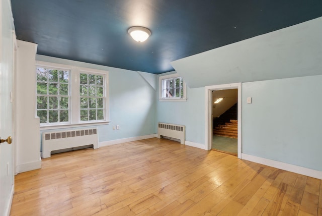 52 Main St, Sanford, ME 04083 - bonus room with radiator heating unit, baseboards, light wood finished floors, and lofted ceiling