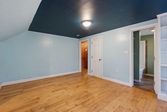 52 Main St, Sanford, ME 04083 - interior space featuring baseboards, lofted ceiling, and hardwood / wood-style floors