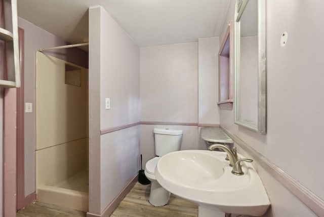 52 Main St, Sanford, ME 04083 - bathroom with toilet, a sink, a shower stall, and wood finished floors
