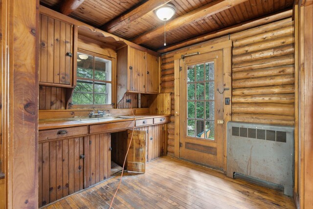 52 Main St, Sanford, ME 04083 - kitchen featuring wood ceiling, radiator heating unit, a healthy amount of sunlight, and beam ceiling