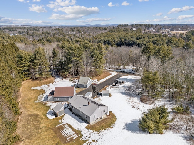 birds eye view of property with a view of trees