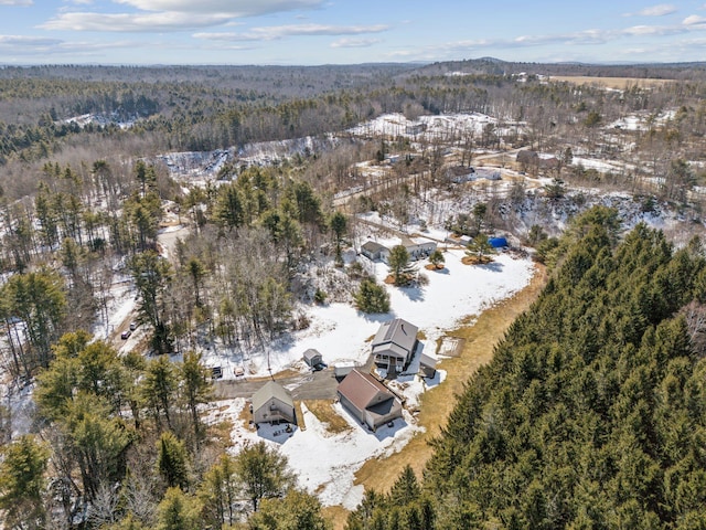 drone / aerial view featuring a forest view