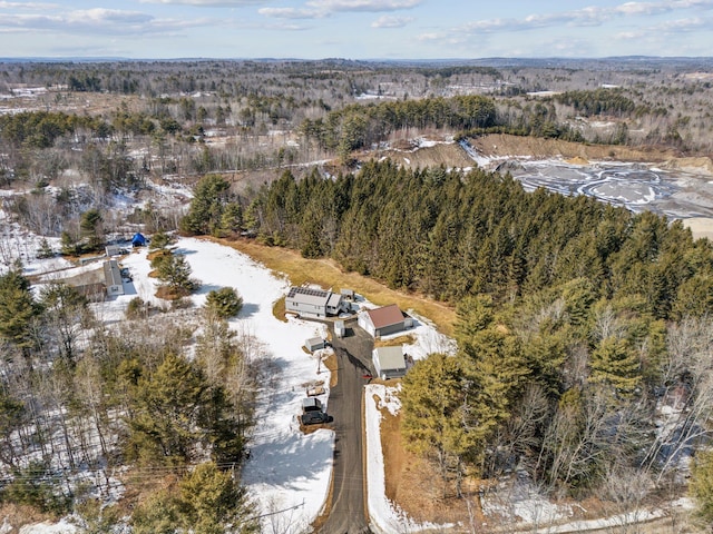 aerial view with a wooded view