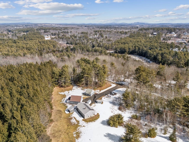 aerial view featuring a view of trees and a mountain view