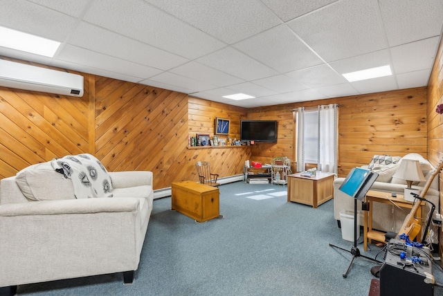 living area with a paneled ceiling, baseboard heating, carpet flooring, and a wall mounted AC