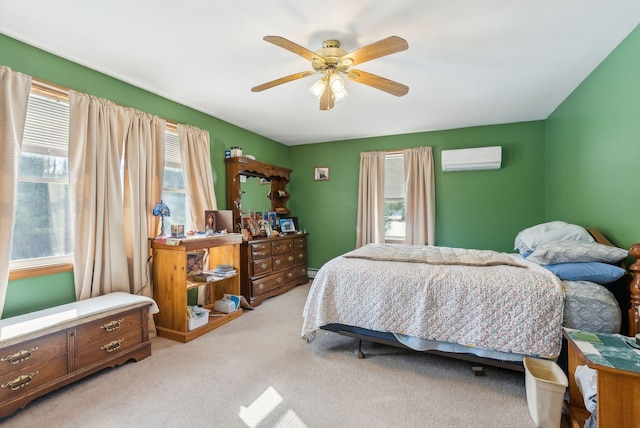 bedroom with light colored carpet, baseboard heating, ceiling fan, and a wall mounted AC