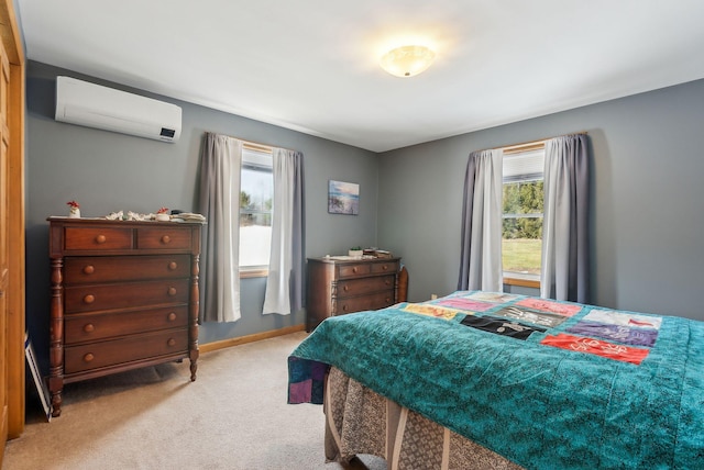 bedroom with baseboards, carpet floors, and an AC wall unit