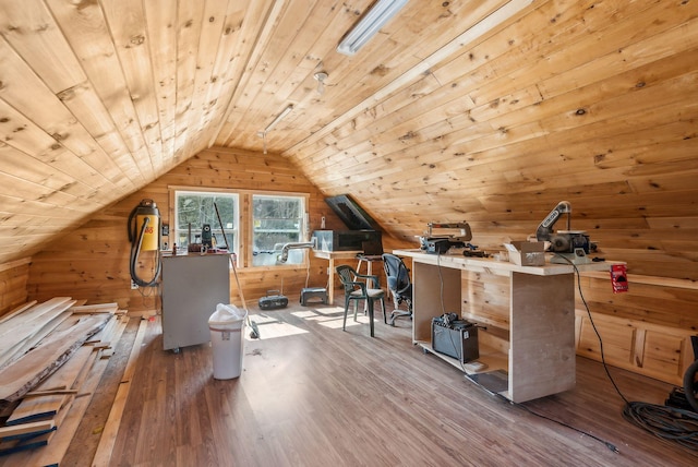 office area featuring wooden ceiling, wooden walls, wood finished floors, and lofted ceiling