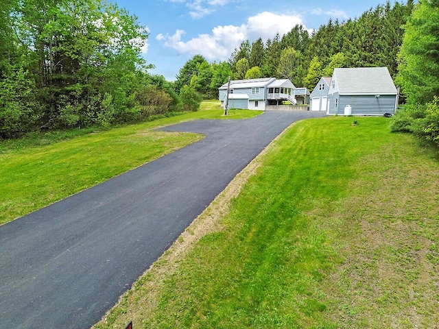 20 Pit Rd, Windsor, ME 04363 - view of front of property with a front lawn, driveway, and a forest view