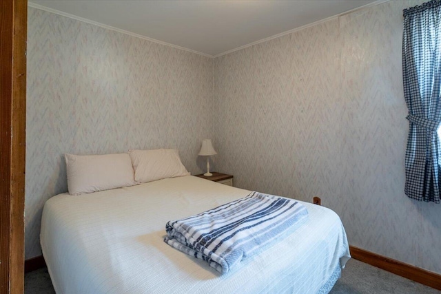 bedroom featuring baseboards, crown molding, and wallpapered walls