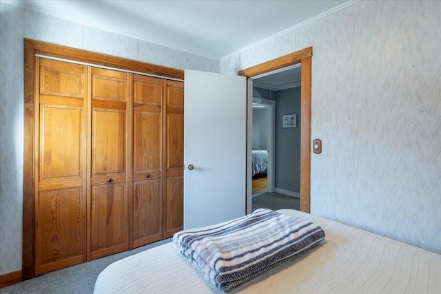 bedroom featuring a closet and carpet