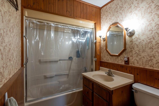 full bath featuring a wainscoted wall, toilet, wallpapered walls, and shower / tub combo with curtain