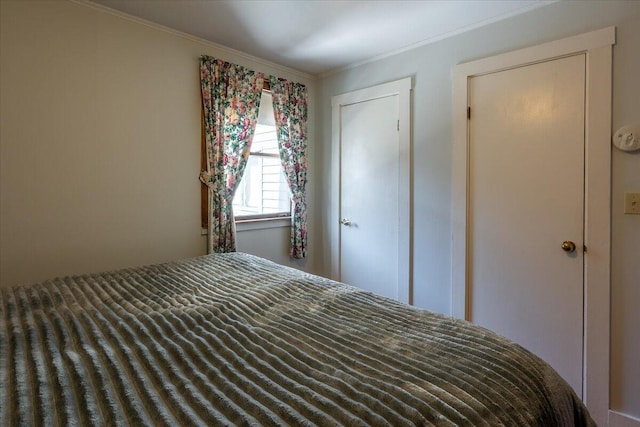 unfurnished bedroom featuring ornamental molding