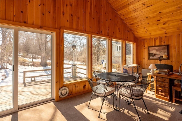 sunroom / solarium with vaulted ceiling, plenty of natural light, and wooden ceiling