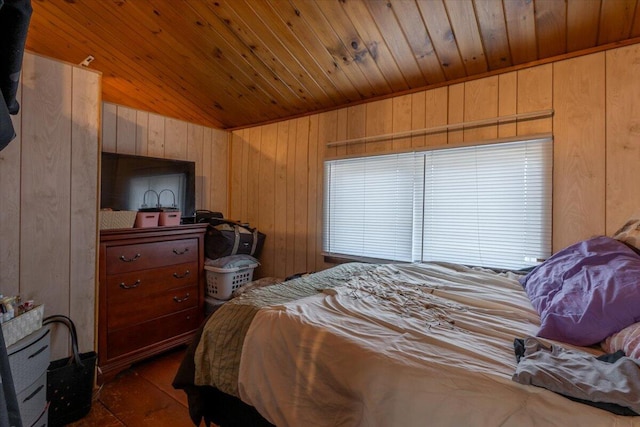 bedroom with wooden walls and wood ceiling