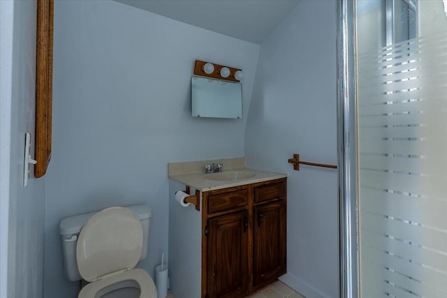 bathroom featuring toilet and vanity