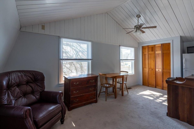 sitting room with lofted ceiling, light colored carpet, and wooden ceiling