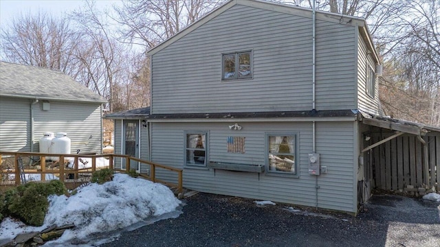 rear view of property with a wooden deck