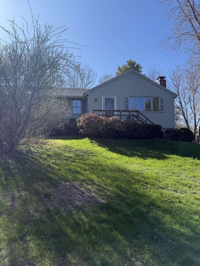 22 Sand Hill Rd, Wiscasset, ME 04578 - view of front of home featuring a chimney and a front lawn