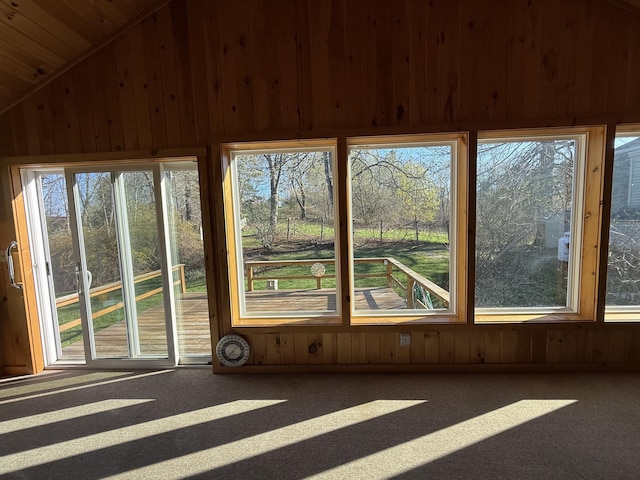 22 Sand Hill Rd, Wiscasset, ME 04578 - unfurnished sunroom featuring wooden walls, carpet, and vaulted ceiling