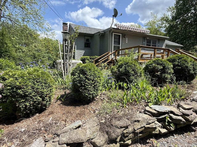22 Sand Hill Rd, Wiscasset, ME 04578 - rear view of property with a deck and a chimney