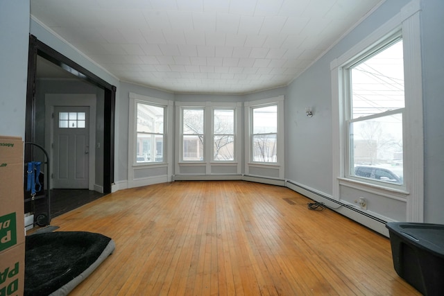 sunroom featuring a baseboard radiator