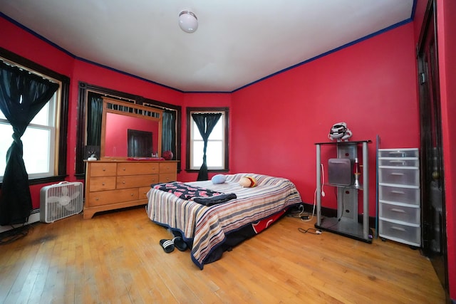 bedroom with wood-type flooring