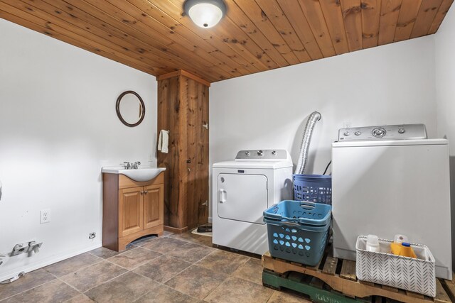 8 Royal Coachman Way, Shapleigh, ME 04076 - washroom featuring cabinet space, washer and dryer, wooden ceiling, and baseboards