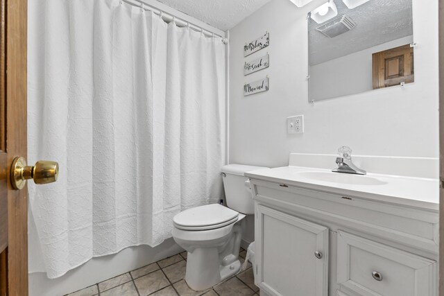8 Royal Coachman Way, Shapleigh, ME 04076 - bathroom featuring a textured ceiling, vanity, tile patterned floors, toilet, and shower / tub combo