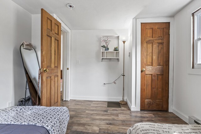 8 Royal Coachman Way, Shapleigh, ME 04076 - bedroom featuring dark wood-style floors, baseboards, and a baseboard heating unit