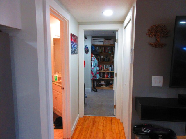 hallway with light wood-type flooring