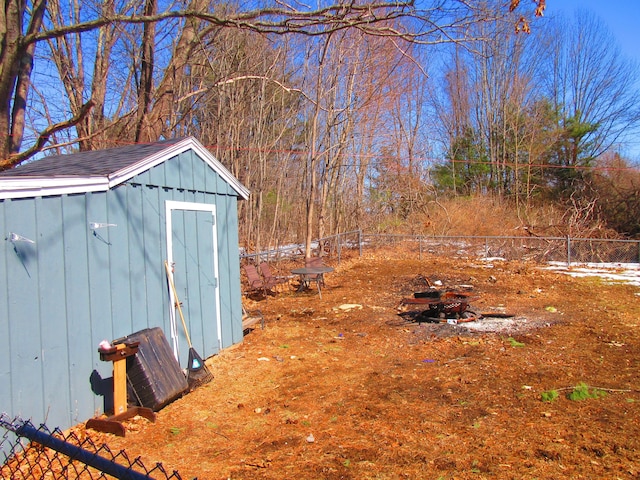 view of shed with fence