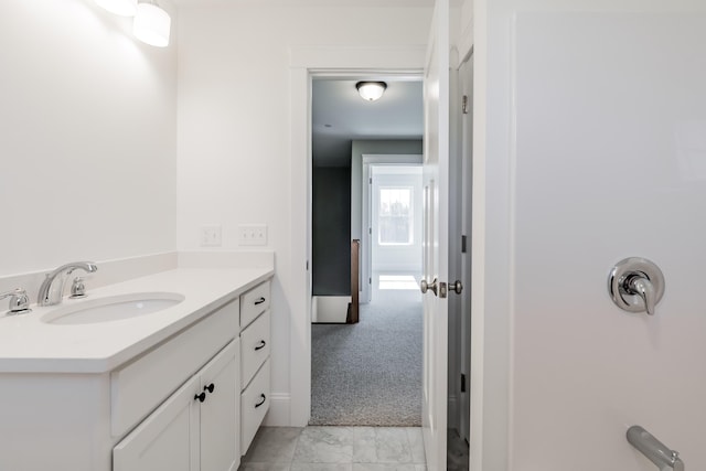 bathroom featuring vanity and marble finish floor