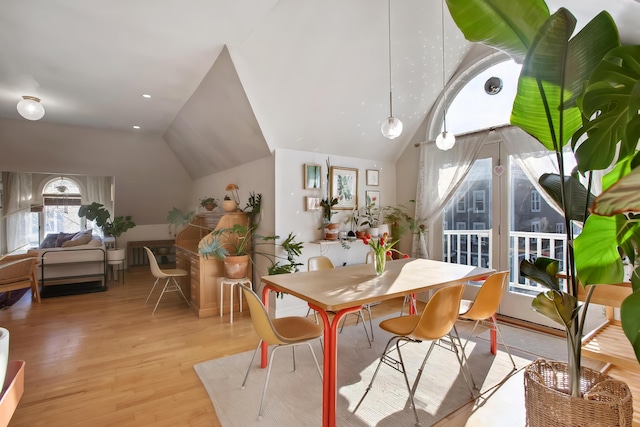 dining space featuring vaulted ceiling, recessed lighting, and light wood-type flooring