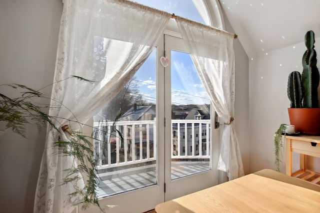 doorway featuring lofted ceiling